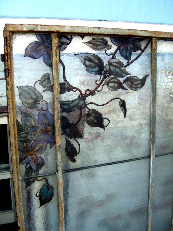 A wonderful iron Victorian window with some hand painted panels. I have tried to capture the beauty of the painting but they panels are truly beautiful. The hinges are rusted and will need to be replaced and there are two panels that have cracks,