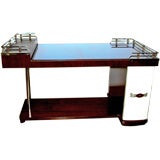 An elegant period art deco chrome wood and blue glass bar