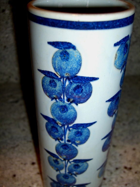 A nice modernist vase by  the noted Royal Copenhagen artist Grethe Helland Hansen Tenera. It features her signature motif of fruit. It is signed Royal Copenhagen and with her cipher on the base.