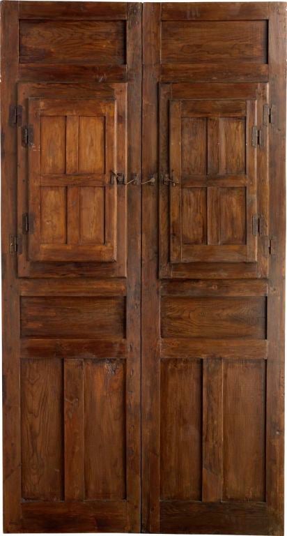 An 18th century antique Spanish double door with windows and iron work.<br />
www.porteradoors.com<br />
*price subject to change based on conversion of €12,196