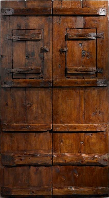 A 17th century antique Spanish double door with carved settings and windows.<br />
www.porteradoors.com<br />
*price subject to change based on conversion of €20,883