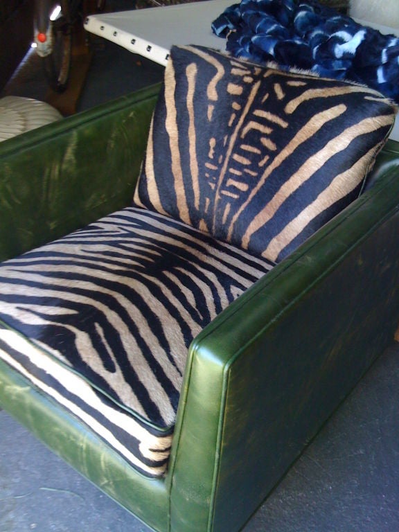recently re-upholstered cube chair.  distressed ivy green leather and latte hide seat and back, ivy welting.  perfect 