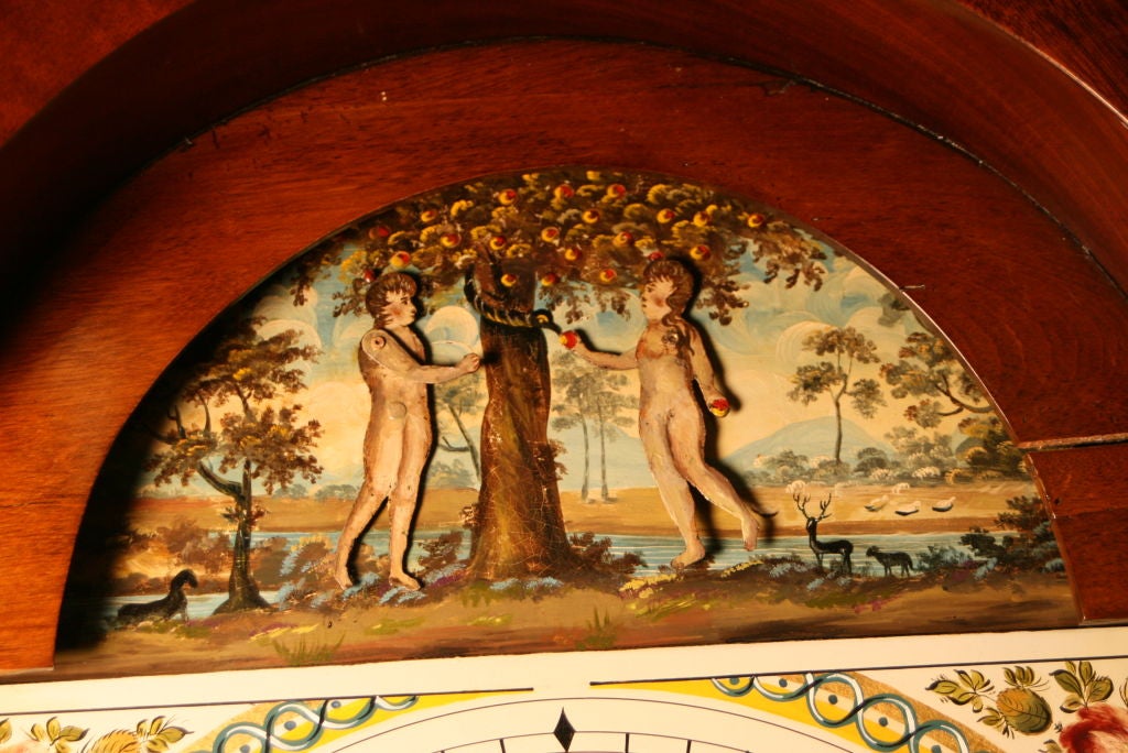 Unusual Adam & Eve Automaton Longcase Clock by William Mortimer of Cullen, Scotland.  The Top secetion depicts Adam & Eve standing by the fruit tree with serpent climbing up the trunk.  They move alternately to pick the fruit from the tree. The case