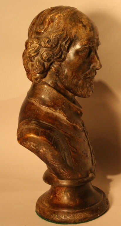 Fine quality Bust of William Shakespeare.  This bust has the appearance and weight of bronze. In fact it is a composite probably resign base with exceptional 'antique' demeanor and patina.  Has induced 'antique distressing'.Caption below bust 'Wm.