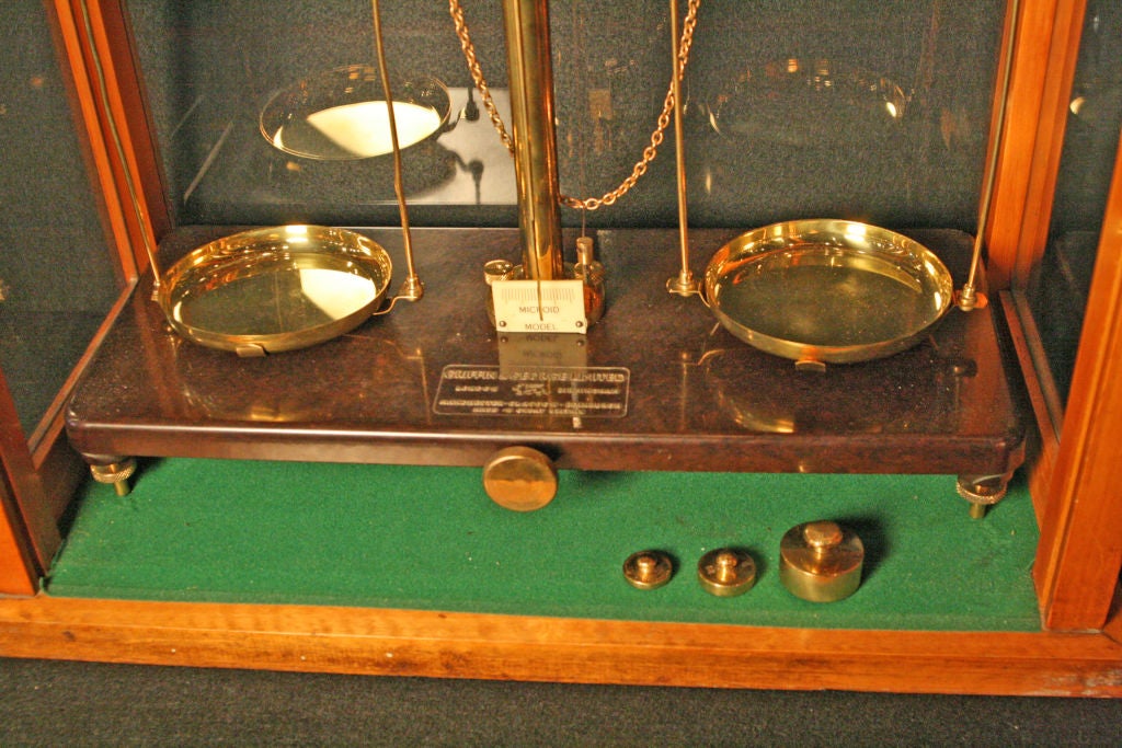 Excellent brass and bacelite English Laboratory Scale in working order.  Three Brass weights.  Satinwood case.  Made by<br />
Griffin & George Ltd. London,Birmingham,Glasgow & Edinburgh England.  Case & Scales stamped 'Made in Great Britain'  Case