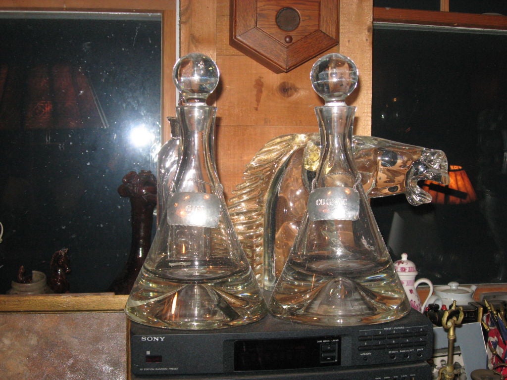 Pair of very heavy crystal decanters with hand hammered peuter labels