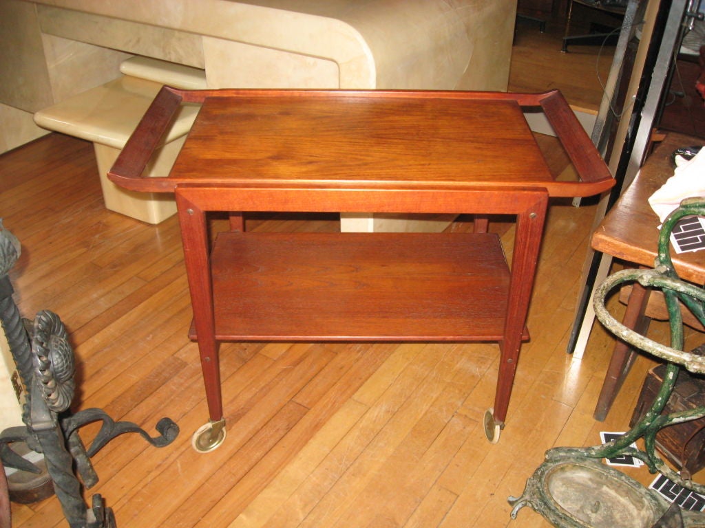 Mid-Century Danish modern oil finish teak bar/serving cart with removable tray, brass casters by Tove 
Edvard Kindt-Larsen-Hampton location.