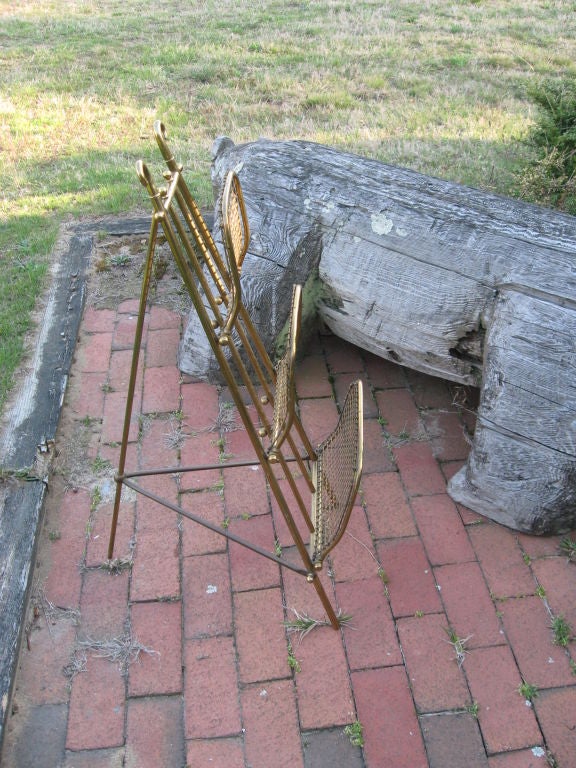 Vintage brass three-tier magazine rack.