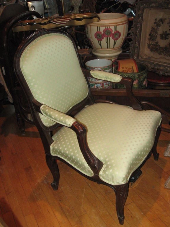 Louis XV style armchair with silk upholstery.