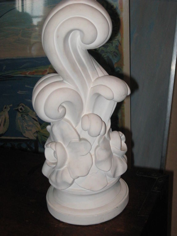 Mid-Century plaster lamp with flowers and scrolls on round base.