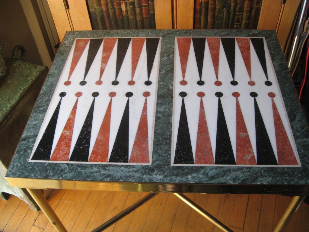 A Custom Made Midcentury Brass and Inlaid Marble Backgammon Table on Brass Coasters with Bagalite Red and Yellow Game Pieces