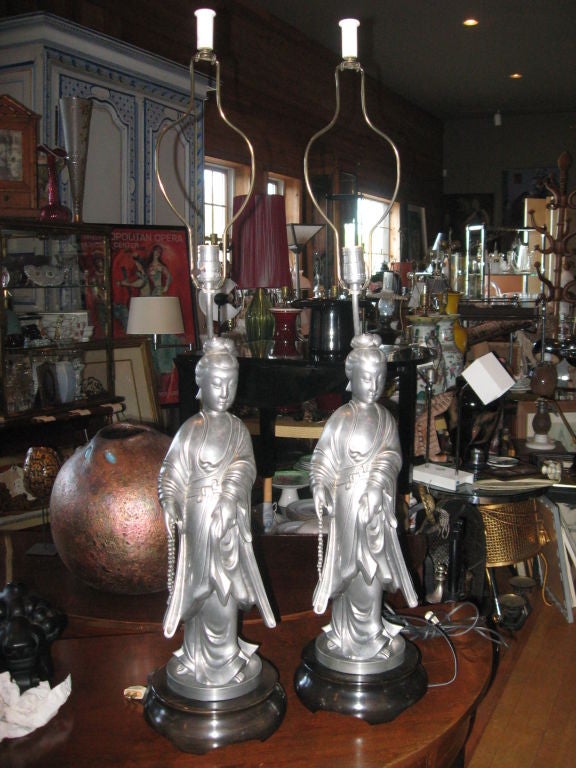 Pair of impressive pewter lamps on wooden bases with alabaster finials in the style of James Mont.