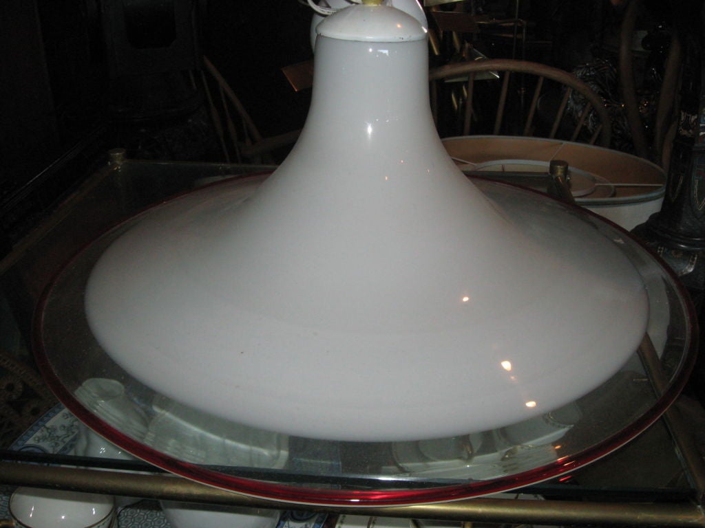 Italian handblown pendant lamp in the style of Venini, circa 1970, in three shades of glass (Opaque white, clear and red) with original ceiling CAP wired.