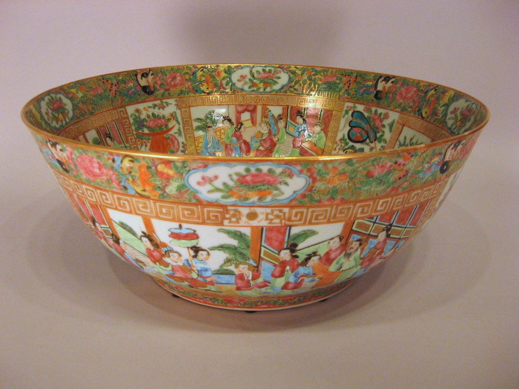 A large Chinese porcelain Punch Bowl, decorated throughout in the rose Medallion design with vignettes of Chinese figures, each scene bordered by gilt Greek Key designs. These surrounded by various floral and foliate designs with rich gilt accents.