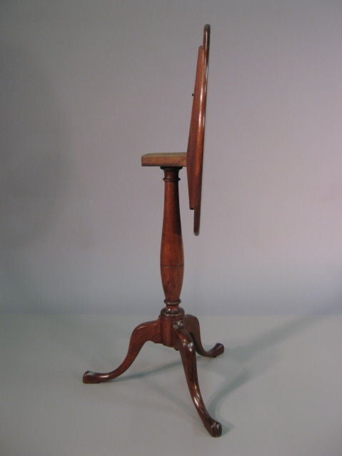 An Oval Candlestand with Tilt-top action, constructed in richly-grained Mahogany. The table dating from the end of the 1700s, and American in origin, Federal Period, possibly Massachusetts. <br />
<br />
The top in figured mahogany with moulded