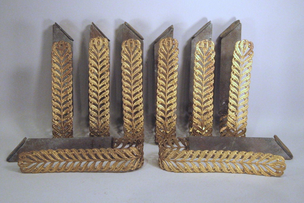 An unusual set of Eight(8) Empire Period curtain Tie-backs, each intricately formed in Bronze as Palmettes, and in an elongated U shape. Each tie-back in Mercuric oxide gilding, with a vivid burnished appearance.<br />
<br />
Designed to be hung