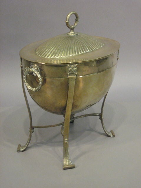 A Fine George III brass coal hod with lid and liner, wreath handles and scroll feet. The coal hod dating from the 1st quarter of the 19th century and English in origin. <br />
<br />
For many more fine antiques, please visit our online galleries