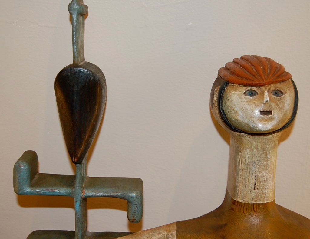 Hanging wall sculpture by Bay Area Artist Stan Dann, titled Racer #17, with early studio label, signed as well. Hand carved out of redwood and hand painted, the subject matter is of a 1880's  Hi- Wheeler bicycle racer in full gear. This is a earlier