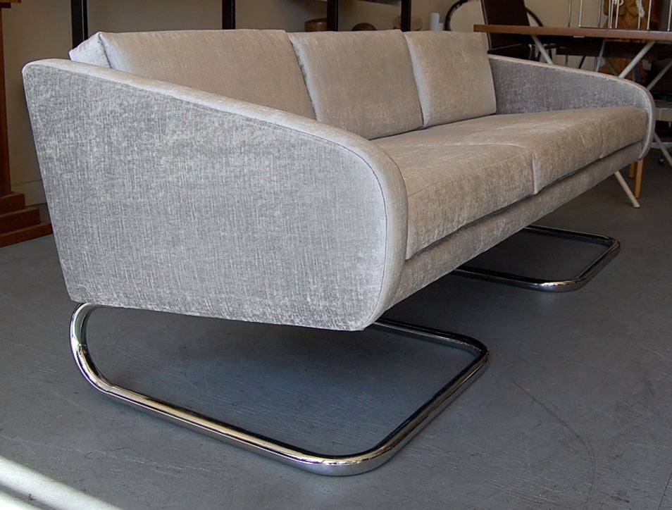 Kangaroo sofa with attribution to designer Kho Liang Le, the cantilever design along with a rakish profile gives this piece a unique appearance, redone in a beautiful grey/silver velvet.