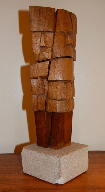 Wooden figural abstract sculpture by William Sildar, multi faceted faces in a totem like form. Sildar was a member of the Brata Gallery in New York City, which was part of the Tenth Street Scene from 1952 to 1962. The Tenth Street Galleries of 
