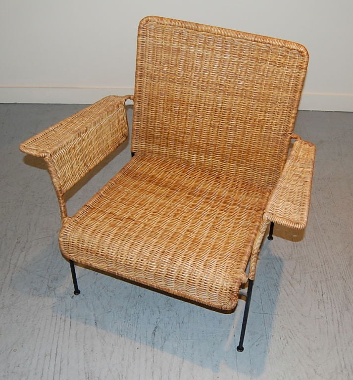 Iron and cane lounge chair, part of the 1950's California vanguard aesthetic that was popularized by such designers as VKG and Luther Conover, just to name a few. The blending of  modern and the organic using iron and cane to create this modernist