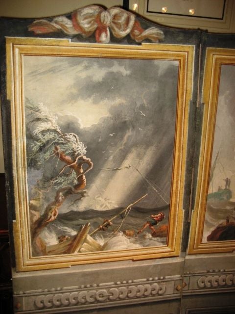 A rare 3-panel canvas screen depicting 3 different harbor scenes by Vernet, the lower sections painted with classical urns and flowers, the reverse in grays with flowers and swags.