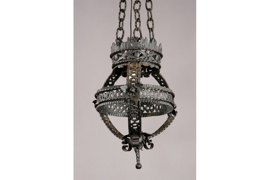 A black painted wrought iron Moorish style hanging lantern, circa 1920.