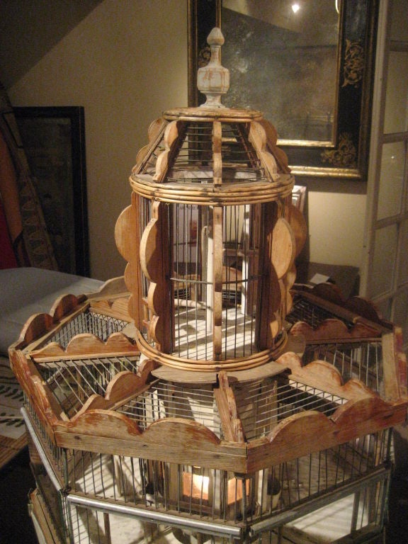 An unusual octogonal wood and wire incubator bird cage, architectural in form, French, circa 1850, now fitted with interior lights to give the 