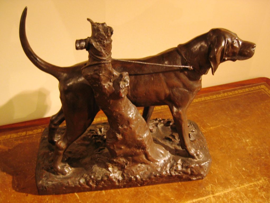 An exceptional 19th century French bronze statue by Auguste-Nicholas Cain (French, 1822-1894) of a hunting dog in a naturalistic setting. Beautiful patina, nice size and perfect condition.