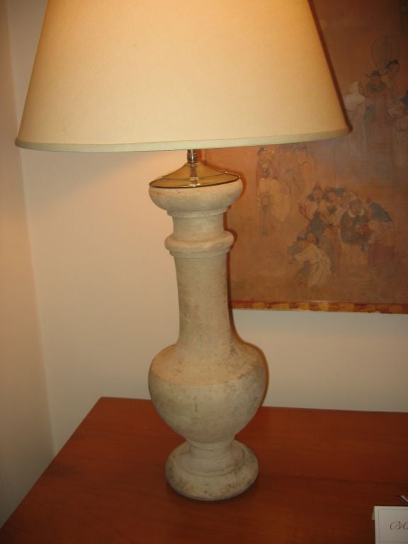 A nice pair of terra cotta ballusters converted to table lamps, newly wired with patinated brass caps and new shades.