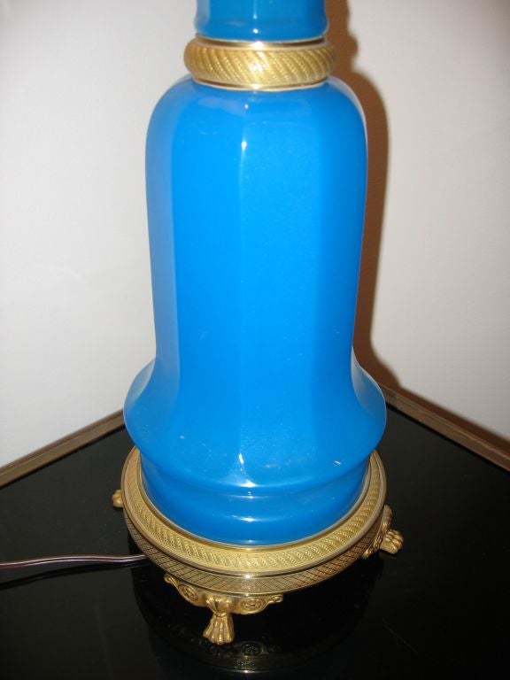 A beautifully mounted blue opaline table lamp in the Empire style, with gilt-bronze mounts.