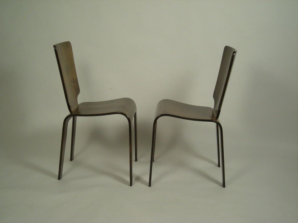 Pair of sculptural molded  and stained birch plywood chairs by the Thaden-Jordan Furniture Company, Virginia.  Herbert von Thaden was at the forefront of experiments in plywood which derived from his experience as a pilot and aeronautical engineer