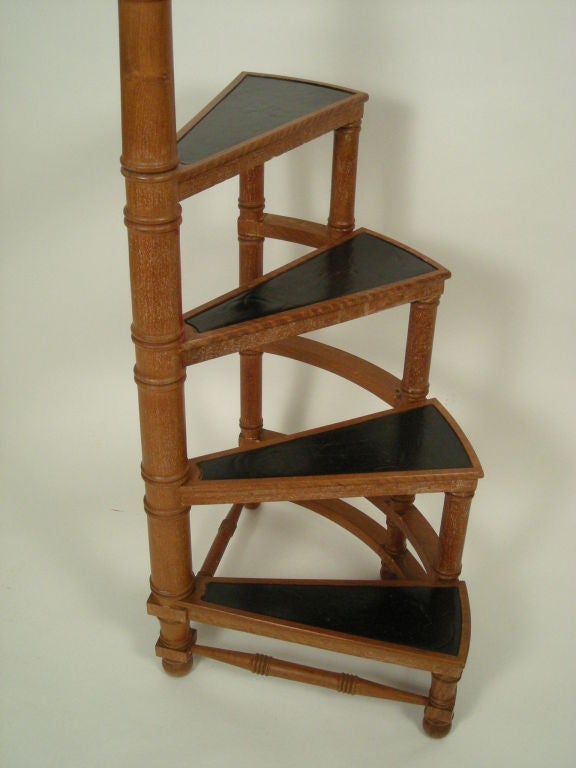 Regency style faux bamboo carved library ladder in teak with inset black leather treads. Solid and structurally sound.