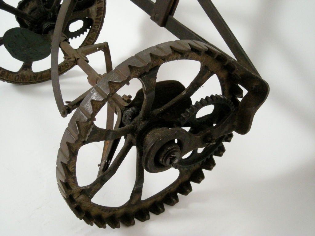 Sculptural, 'early industrial' cast iron lawn mower, the 'Allcut