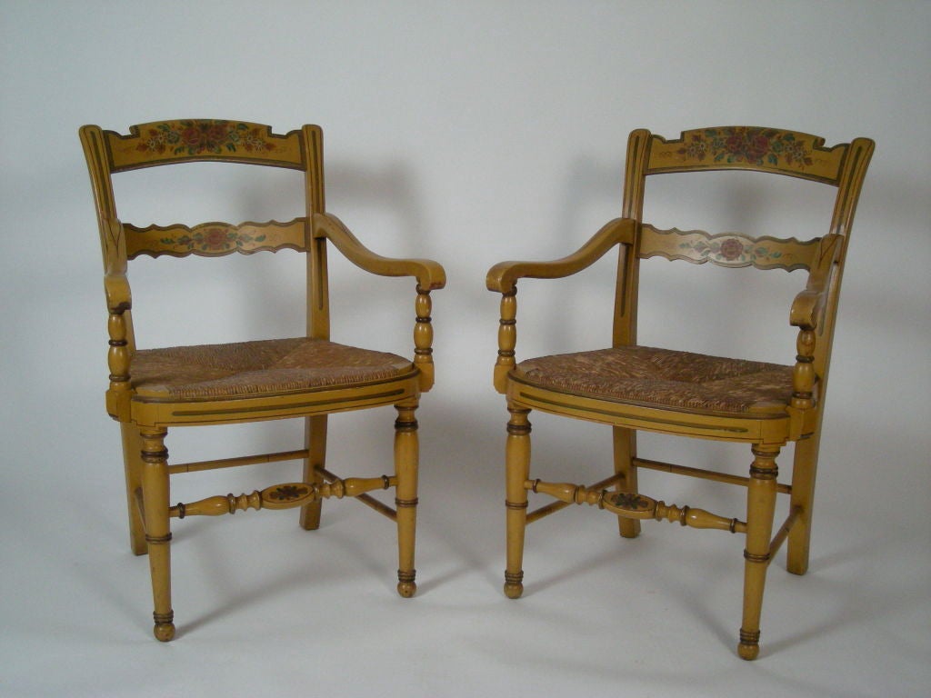 Set of 6 stencil decorated ochre/yellow Hitchcock armchairs, each decorated with painted pinstripe and stenciled floral decoration, made by the historic Hitchcock Chair Company (1818-2006) in Riverton, Connecticut. Very solid, well