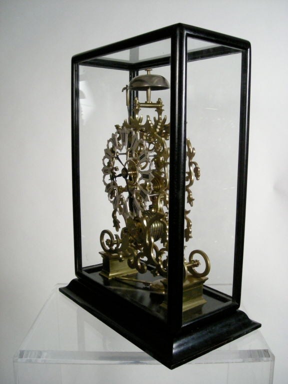 English skeleton clock, attributed to Smith and Sons, Clerkenwell, the pierced brass plates of scrolled and gothic pattern housing a fusee timepiece with recoil escapement and 