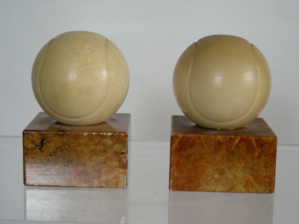 PAIR OF MARBLE TENNIS BALL BOOKENDS