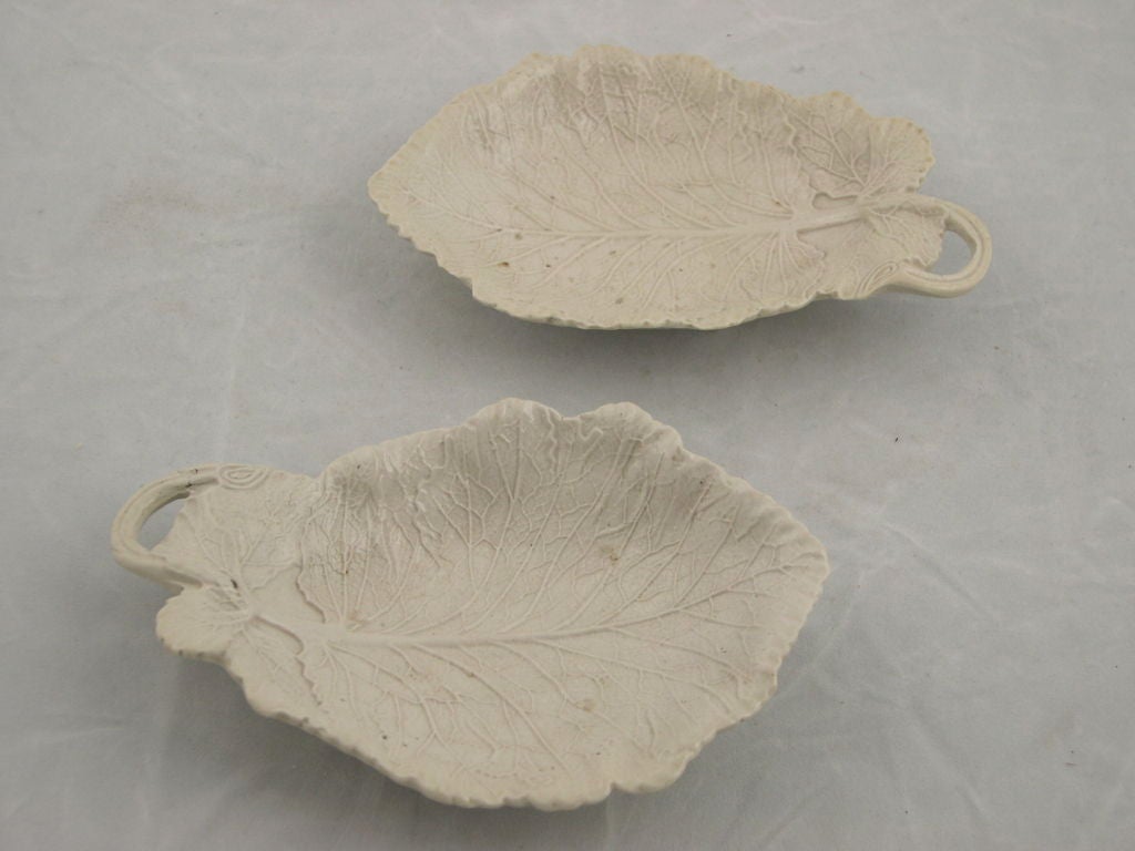 Pair of very finely modeled Staffordshire salt glazed ceramic leaf form relish dishes.  English, circa 1750.