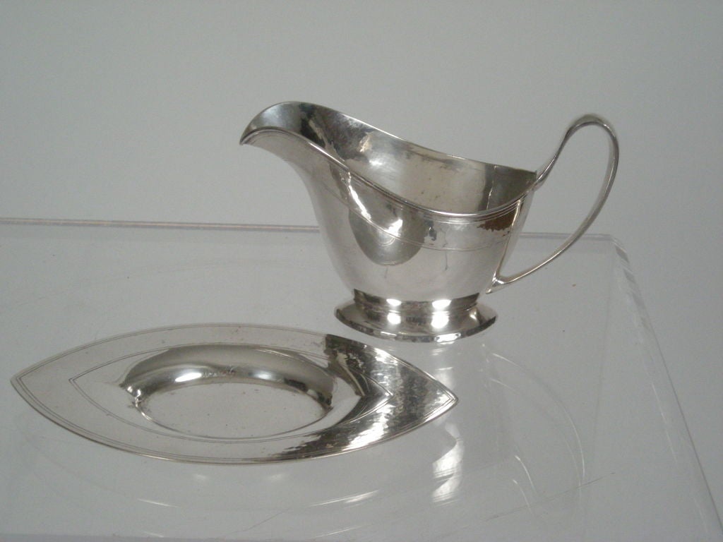 Neoclassical style Sheffield silver plate gravy boat with matching navette form under tray, decorated with fine, incised parallel lines and  Arts & Crafts hammered surface, by Pairpoint. Signed  