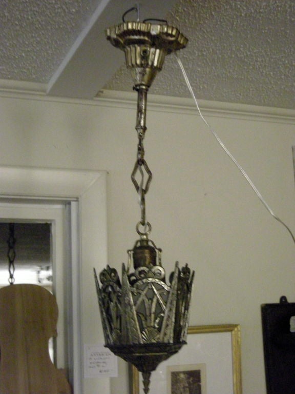 Art deco period nickel or chrome plated hanging light fixture, with frosted glass panels and original chain and ceiling bell for hanging.  High style, Chrysler building-esque design. Newly re-wired.Perfect for hallway or bathroom.