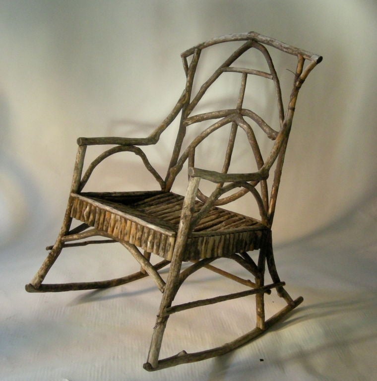 A well proportioned and beautifully weathered, but strong Adirondack twig rocking chair, generously proportioned, comfortable and solid. Compatible with additional Adirondack twig rocker and chair posted separately.