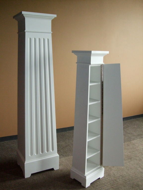 Custom architectural column cupboards in a white painted finish. 

Two sizes available:
Large column cupboard-$1,800, 84" H x 19.5" W x 16.5" D.
Small column cupboard-$1,700, 66" H x 14" W x 11.5" D.