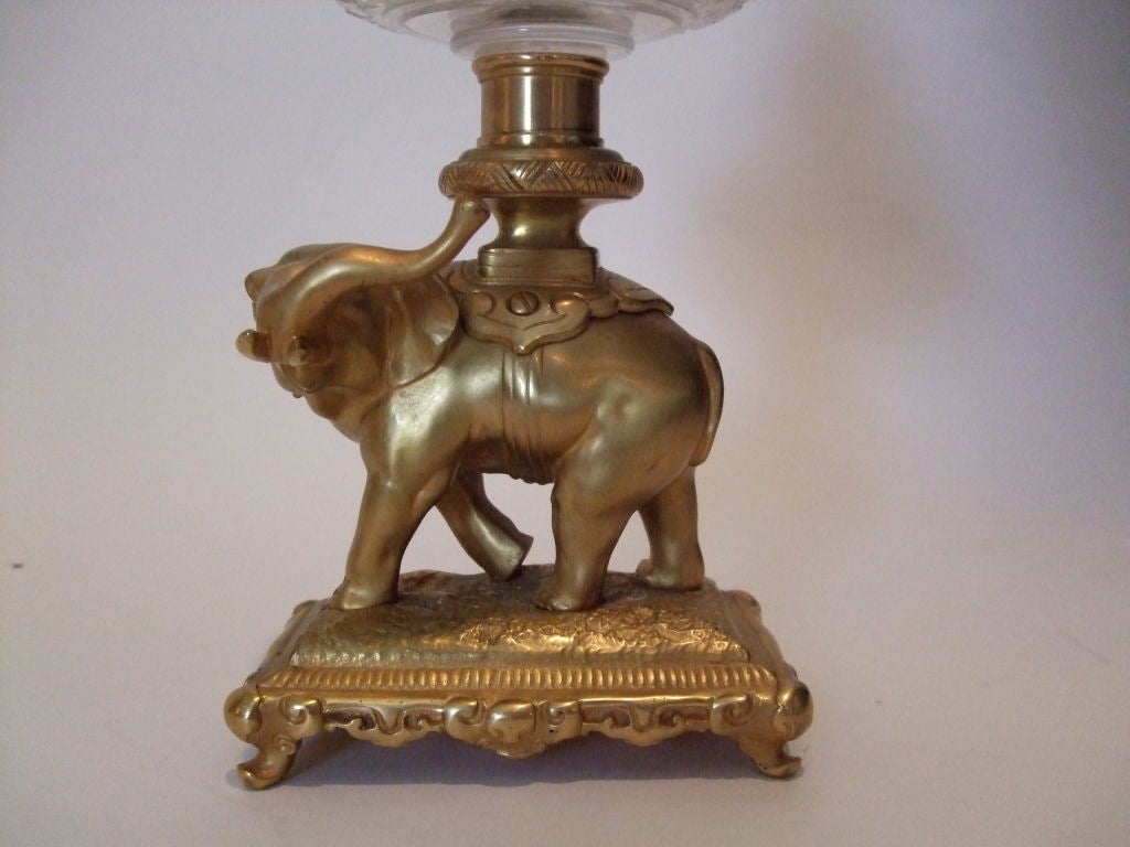 Newly electrified crystal oil lamp with gilt bronze elephant base.