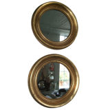 Pair of round giltwood mirrors