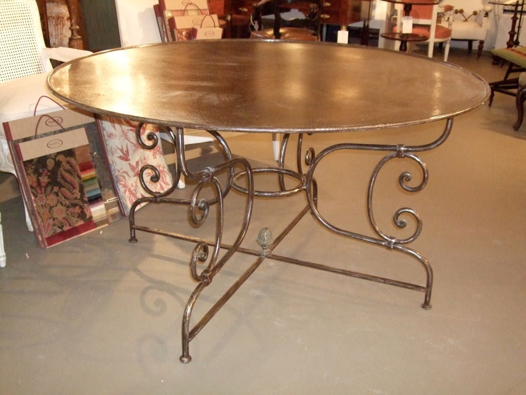 Round Steel dining table with scrolled feet & acorn finial. Nice patina.