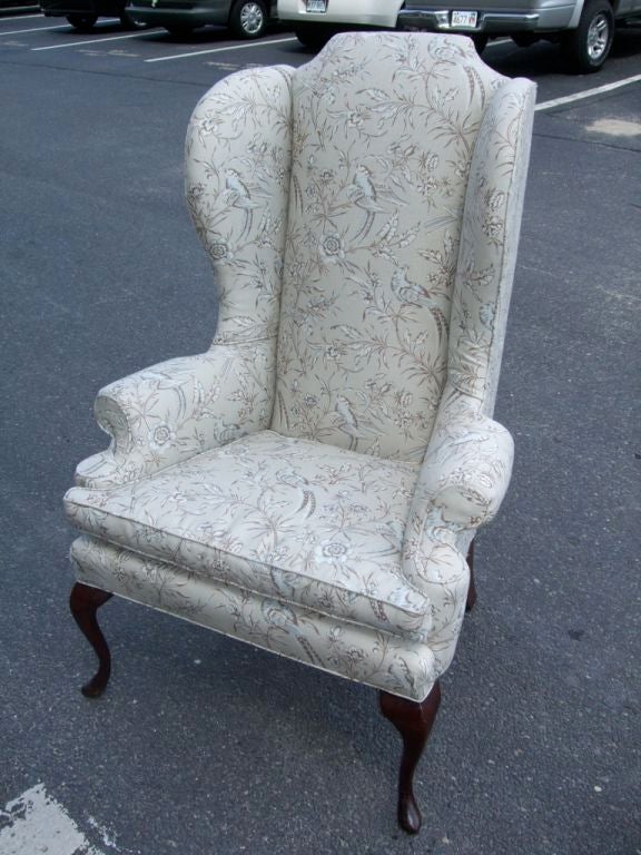 A newly upholstered high back Queen Anne style wing chair in grey/ blue Scalamandre toile.