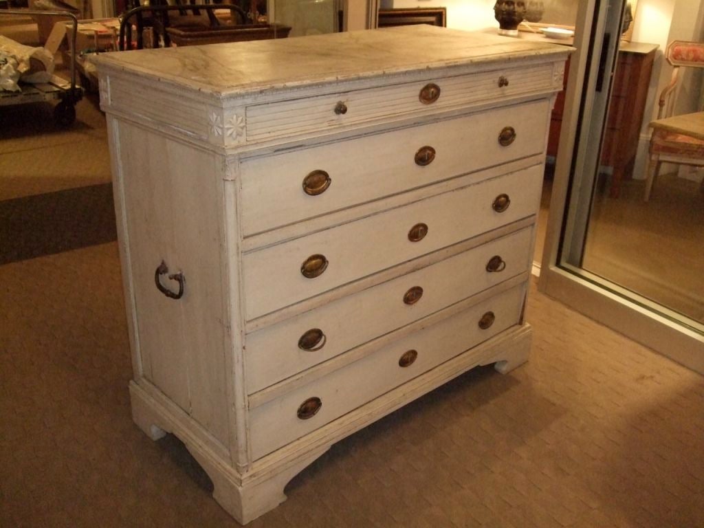 19th century painted Swedish chest of drawers with marbleized top and decorative corner rosettes. Original hardware.