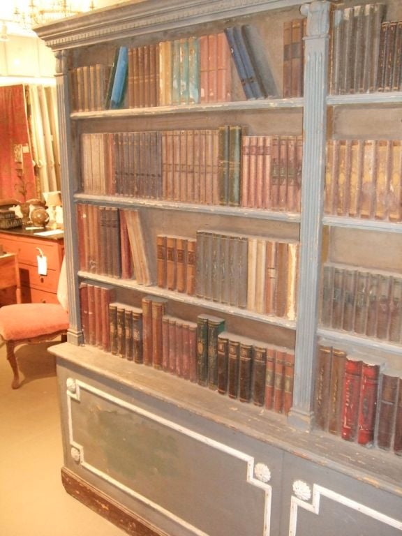 A wonderful stage prop bookcase with original paint. Headboard?