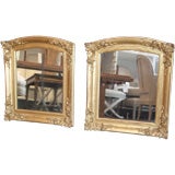 Pair of arched top gilt mirrors