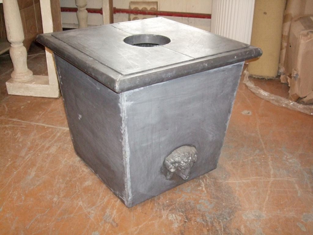 Large zinc planter with ram's head and removable top.